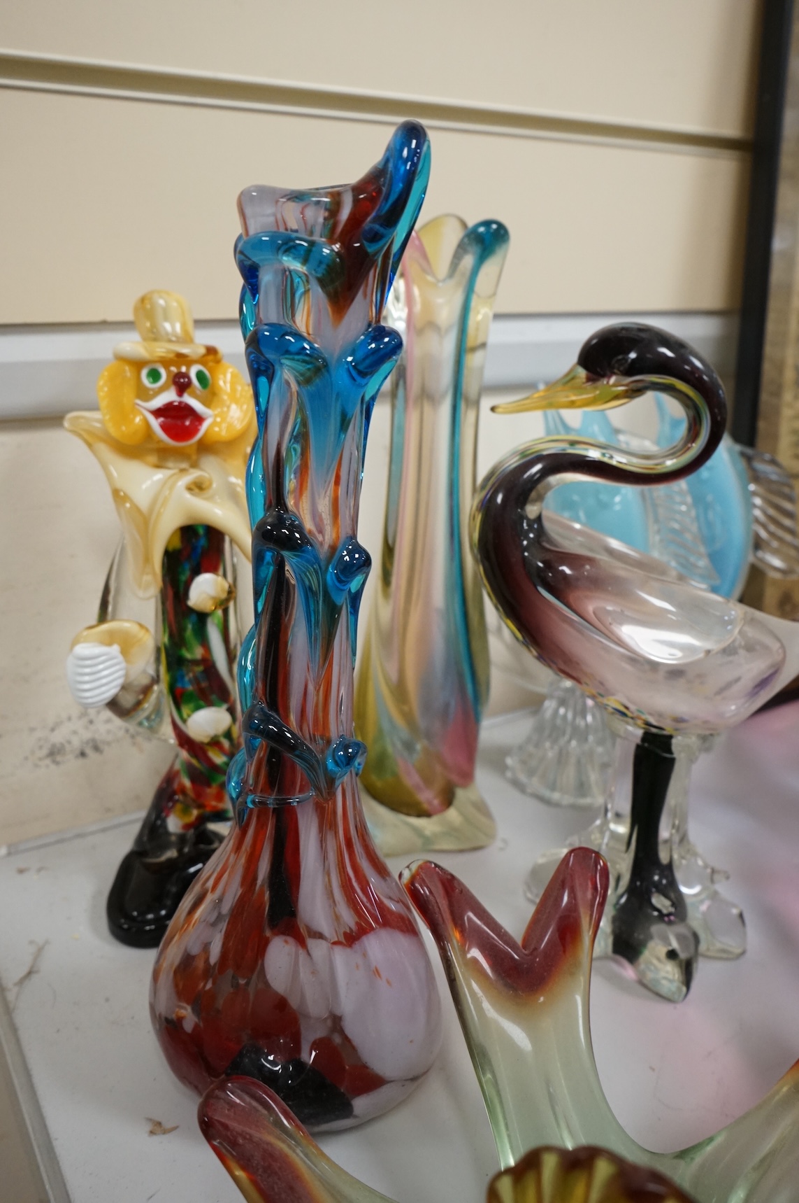 Two multi-coloured Murano glass clowns, a pair of 'fish' vases and modernist glassware, tallest 32cm